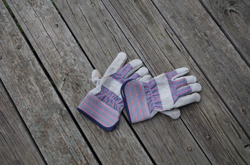 Inexpensive cotton and sueded leather work gloves - palms down