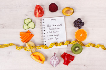 Fruits and vegetables and centimeter, new year resolutions of healthy lifestyles and slimming