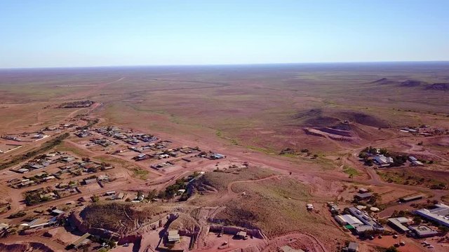 Aerial drone shot reveals the outback bush opal mining town of Coober Pedy, Australia.