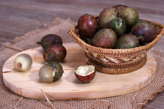 Matoa fruit (pometia pinnata) a typical fruit native from Papua island served on the table.