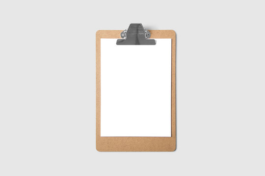 Clipboard with a sheet of white paper isolated on soft gray background.High resolution photo.