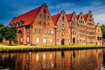 Fototapeta premium The Salzspeicher (salt storehouses), six historic brick buildings on the Upper Trave River in Luebeck, Schleswig-Holstein, northern Germany.