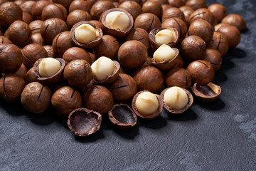 Macadamia nuts on black table, Selective focus.