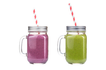 Refreshing cocktails in glass jars on a white background.