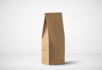 Brown craft paper tall bag packaging template isolated on soft gray background. Packaging template...