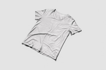 Front view white t-shirt on soft gray background.T-Shirt mock-up flat lay on soft gray background. Template for your design.3D illustration