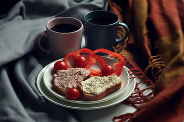 Breakfast sandwiches and coffee on the table