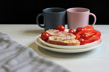 Breakfast sandwiches and coffee on the table