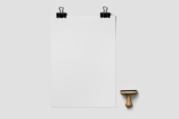 Empty A4 paper mock-up with paper clip and with a stamp isolated on white background