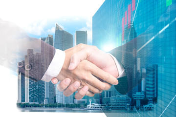 Double exposure of business partner handshake and Display stock market investment trading , Business analyzing financial statistics Finance concept