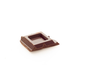 Cubes of dark chocolate white background