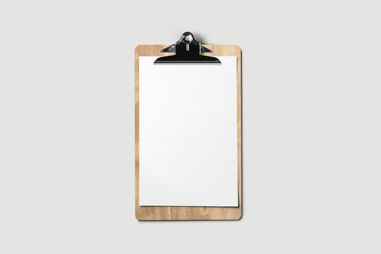 A wooden clipboard with a blank piece of paper .