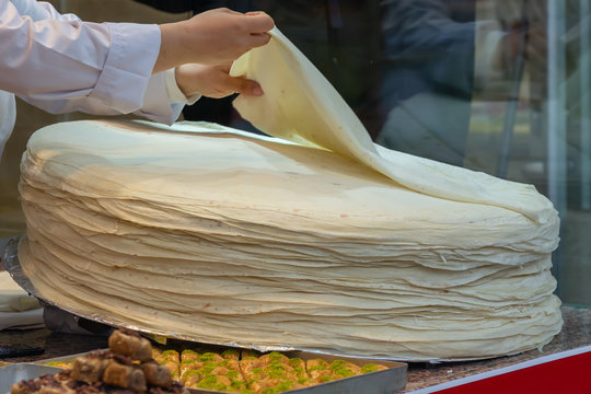 large pile of sheets of dough - Turkish huge circular thin flatbread sheets, ingredients for making borek and yufka