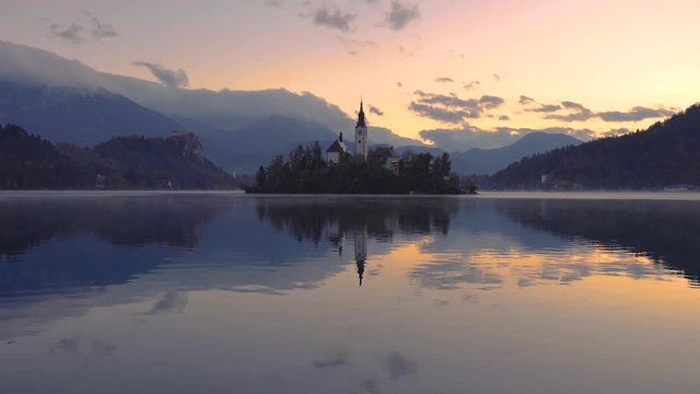 Sunset over Lake Bled with St. Marys Church of the Assumption on the small island; Slovenia, Europe