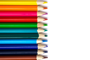 Colored pencils isolated on white with copy space