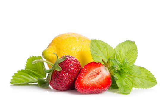 lemon, mint leaves and strawberries isolated on white