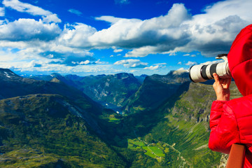 Tourist taking photo from Dalsnibba viewpoint Norway