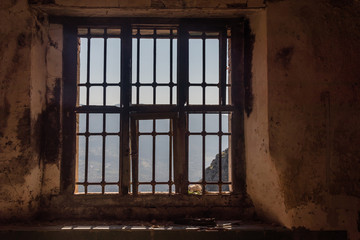 Fototapeta na wymiar Looking out a Window in an Abandoned Ruin in Southern Italy