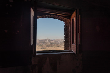 Looking out a Window in an Abandoned Ruin in Southern Italy