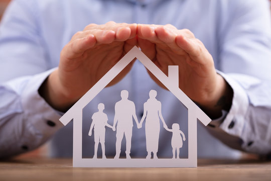 Businessman Protecting Family Home