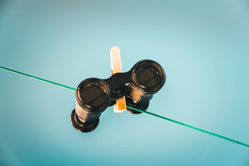 binoculars on a clothesline