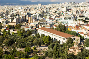 Fototapeta na wymiar Athens city street with many white buildings and antique ancient temple aerial photography 