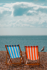 Empty Deckchairs on Beach