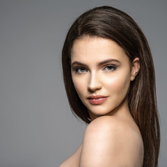 Portrait of beautiful young brunette woman with clean face.