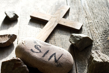 Cross sins and stones abstract easter confession religion background