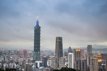 Fototapeta na wymiar Taipei 101 tower at night with fog cover on top