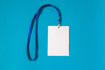 Empty ID card badge icon with blue belt, on blue background. Space for text,  staff identity name tag template.