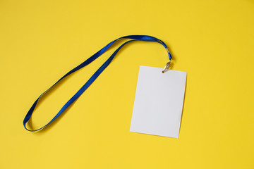 Empty ID card badge icon with blue belt, on yellow background. Space for text,  staff identity name...