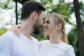 Obraz premium Young couple in love at the park, romance concept