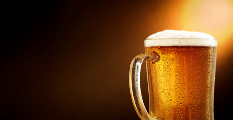 Cold beer and brown background with shadow 