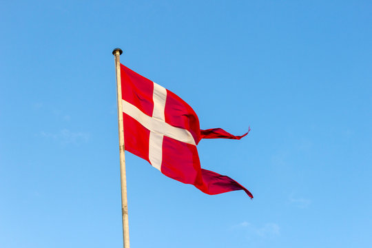 Flag of Denmark against the blue sky
