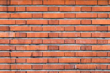 mur en briques rectangulaires rouges