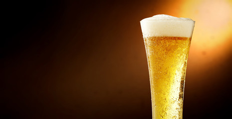 Cold beer and brown background with shadow 