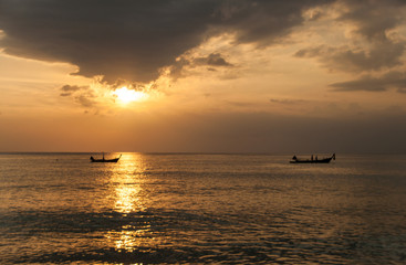 Naklejka na ściany i meble Sunset on the Naithon beach on Phuket in Thailand