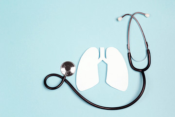 Lungs symbol with stethoscope on blue background. World Tuberculosis Day.