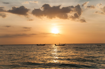 Naklejka na ściany i meble Sunset on the Naithon beach on Phuket in Thailand