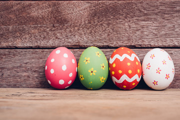 Beautiful Easter egg on wooden background