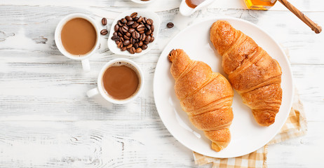 Delicious breakfast with fresh croissants.