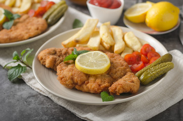 Homemade german schnitzel with pickles