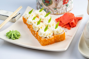 Sushi platter isolated on white background. Japanese food restaurant delivery - maki california rolls big party set, top view