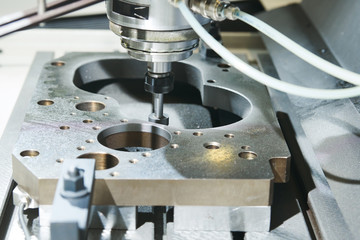 grinding or polishing metal detail on CNC machine.
