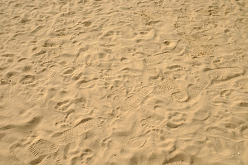 sea sand with footprints