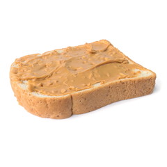 Fresh whole wheat bread slice with chunky peanut butter isolated on a white background.