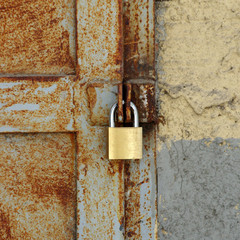 old rusty lock with new lock