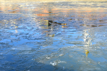 Anticipation of spring. Reflection of Kremlin cathedral and tower in waters of Moscow River. Russia