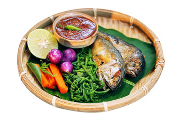 Fototapeta na wymiar Nam prig Kapi is shrimp paste mix chili sauce served with boiled and fresh vegetables the table. Steamed rice and boiled egg served with fried fish and shrimp paste. Popular food in Thailand.